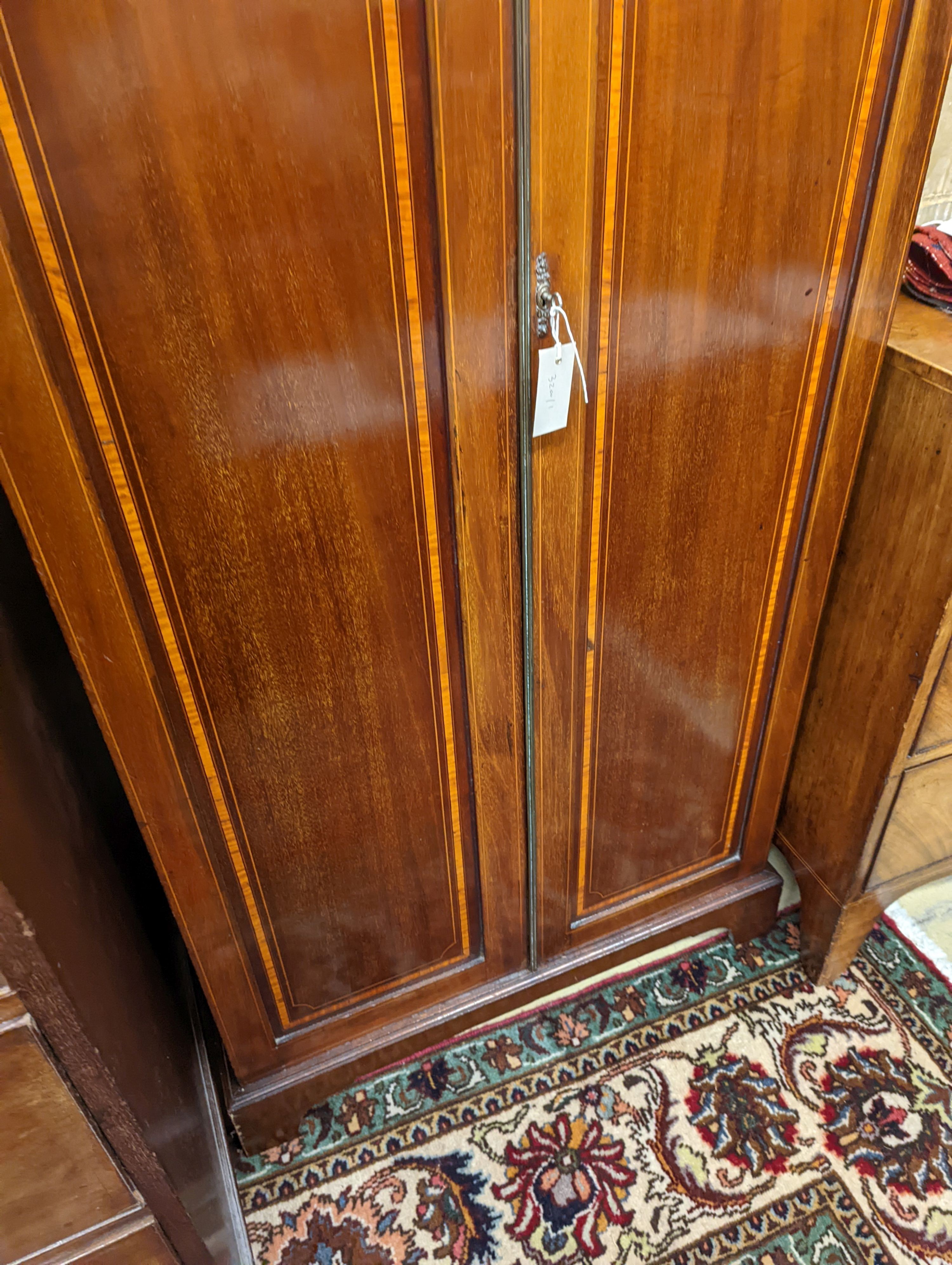 A Edwardian satinwood banded mahogany two door bookcase, width 83cm, depth 31cm, height 198cm